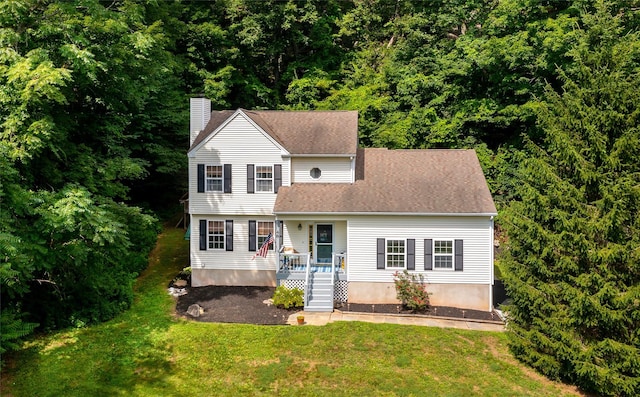 48 Devon Rd, Patterson, NY 12563 - view of front of home featuring a chimney and a front lawn