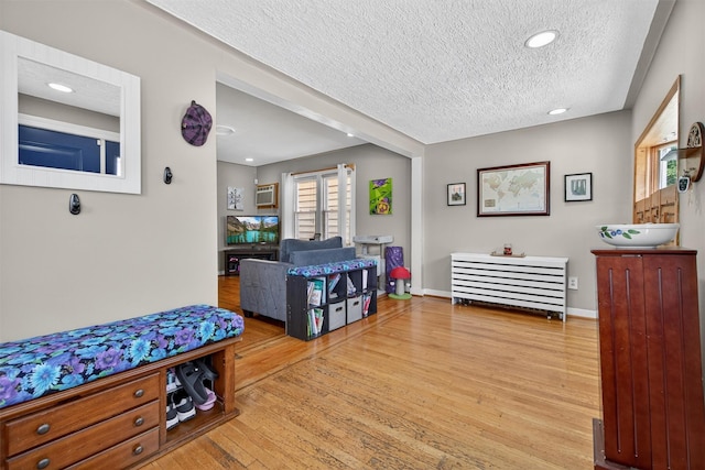 829 Logan Ave, Bronx, NY 10465 - corridor featuring a textured ceiling, wood finished floors, recessed lighting, and a wall unit AC