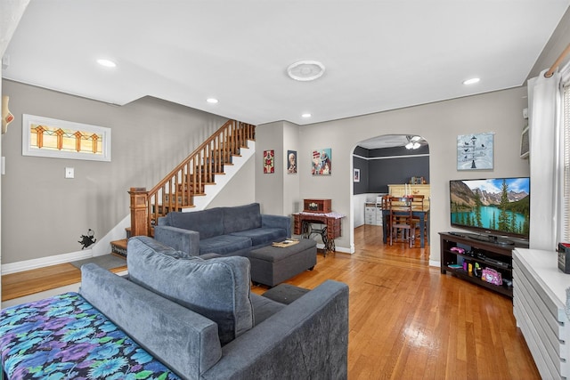829 Logan Ave, Bronx, NY 10465 - living area with stairs, light wood-type flooring, arched walkways, and recessed lighting