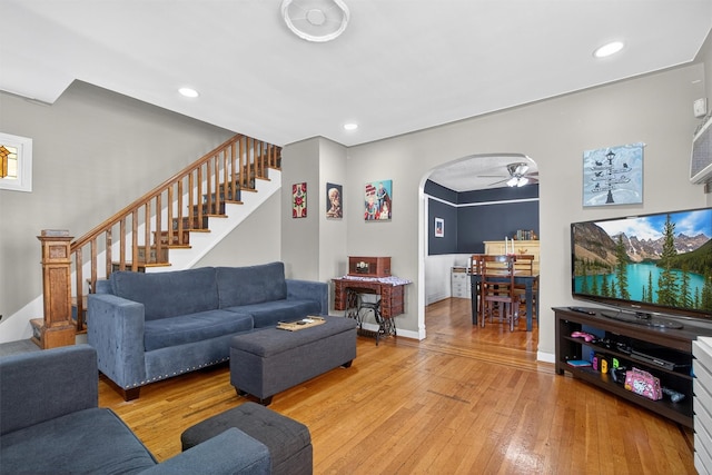 829 Logan Ave, Bronx, NY 10465 - living room featuring stairway, arched walkways, light wood finished floors, ceiling fan, and recessed lighting