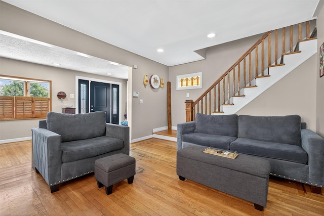 829 Logan Ave, Bronx, NY 10465 - living room featuring stairway, hardwood / wood-style floors, and recessed lighting