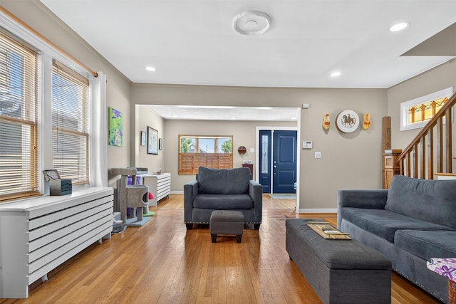 829 Logan Ave, Bronx, NY 10465 - living area featuring light wood-style flooring, stairs, and recessed lighting