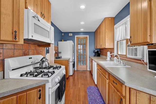 829 Logan Ave, Bronx, NY 10465 - kitchen featuring white appliances, decorative backsplash, recessed lighting, light wood finished floors, and light countertops