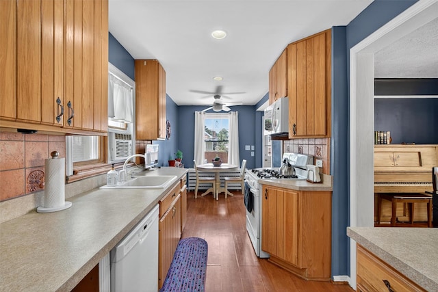 829 Logan Ave, Bronx, NY 10465 - kitchen with white appliances, a ceiling fan, tasteful backsplash, wood finished floors, and light countertops