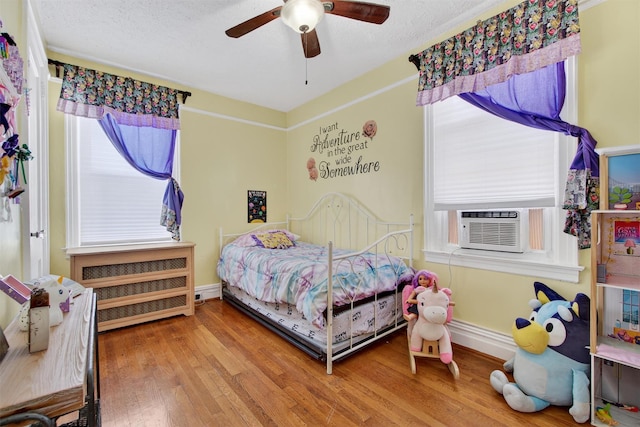 829 Logan Ave, Bronx, NY 10465 - bedroom with wood finished floors, ceiling fan, and cooling unit
