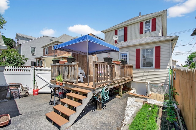 829 Logan Ave, Bronx, NY 10465 - back of property with a fenced backyard and a wooden deck