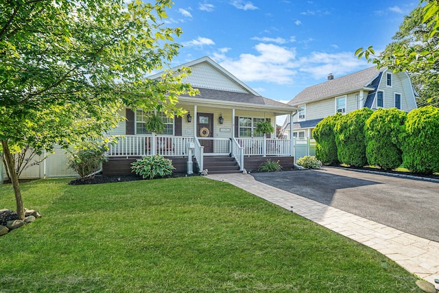 4 Ferndale Blvd, Islip, NY 11751 - view of front facade with a porch, a front yard, and asphalt driveway