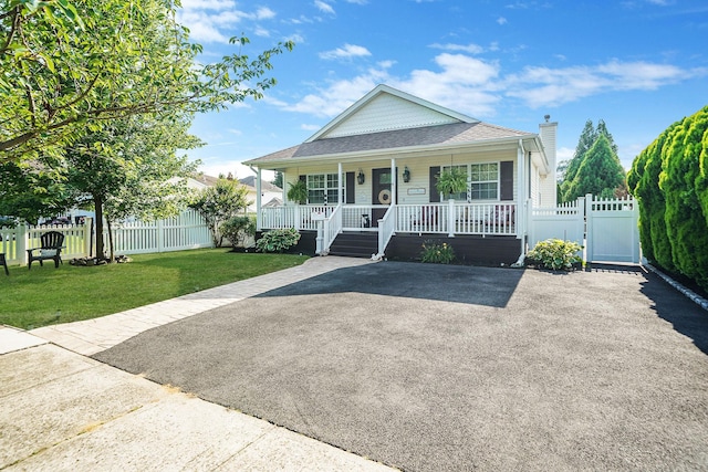 4 Ferndale Blvd, Islip, NY 11751 - view of front of house with a porch, a gate, a chimney, and a shingled roof