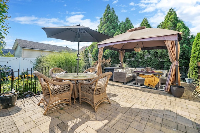 4 Ferndale Blvd, Islip, NY 11751 - fenced backyard with a gazebo, a patio area, an outdoor living space with a fire pit, and outdoor dining area