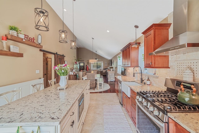 4 Ferndale Blvd, Islip, NY 11751 - kitchen with wall chimney range hood, stainless steel appliances, a barn door, a center island, and light stone counters