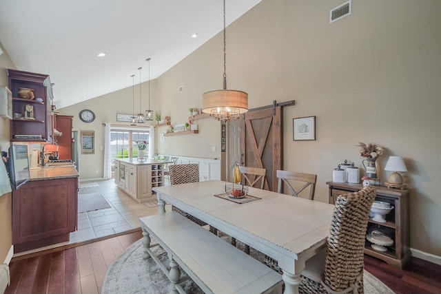 4 Ferndale Blvd, Islip, NY 11751 - dining room featuring a barn door, high vaulted ceiling, light wood-style flooring, a chandelier, and recessed lighting