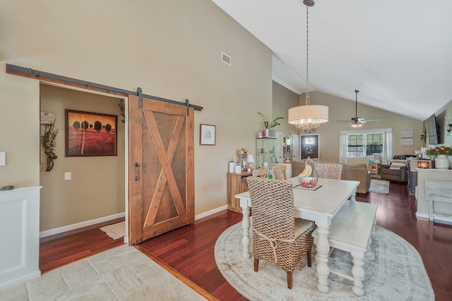 4 Ferndale Blvd, Islip, NY 11751 - dining space with a barn door, wood finished floors, a ceiling fan, and high vaulted ceiling