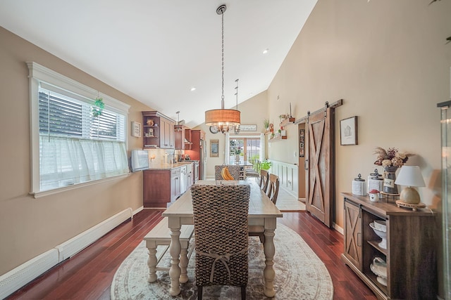 4 Ferndale Blvd, Islip, NY 11751 - dining space featuring a barn door, a baseboard radiator, a chandelier, dark wood-type flooring, and high vaulted ceiling