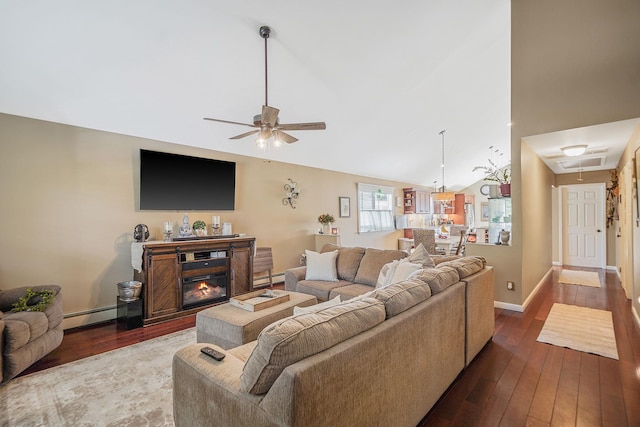 4 Ferndale Blvd, Islip, NY 11751 - living room with a baseboard heating unit, attic access, a ceiling fan, dark wood finished floors, and vaulted ceiling