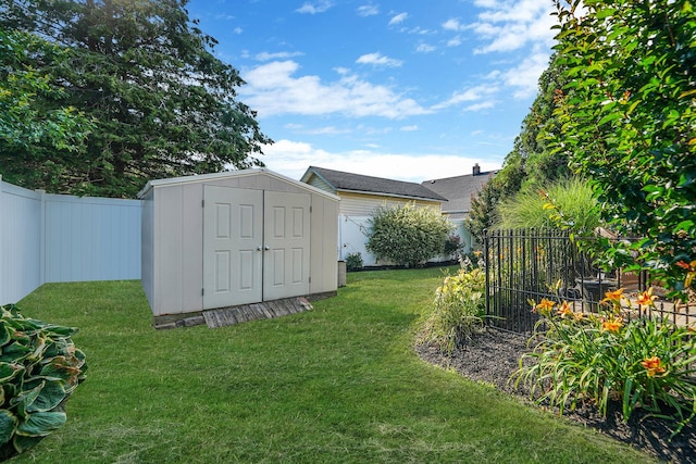4 Ferndale Blvd, Islip, NY 11751 - fenced backyard featuring a storage unit