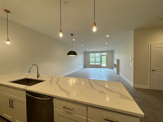 30 Beekman St Unit Ph3, Beacon, NY 12508 - kitchen featuring dishwasher, white cabinets, open floor plan, light stone counters, and pendant lighting