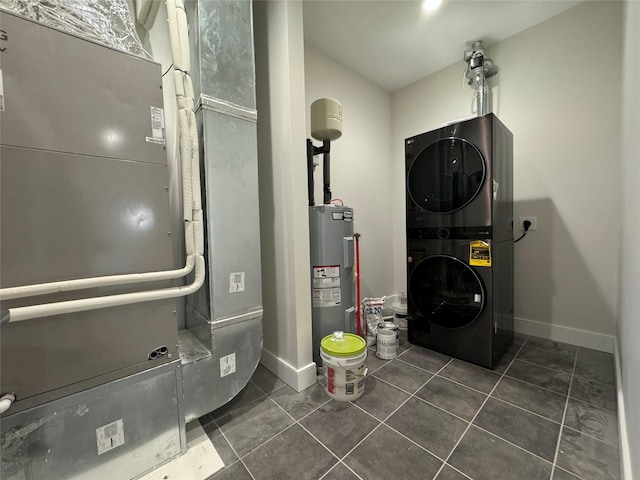 30 Beekman St Unit Ph3, Beacon, NY 12508 - utility room featuring estacked washer and dryer, electric water heater, and heating unit