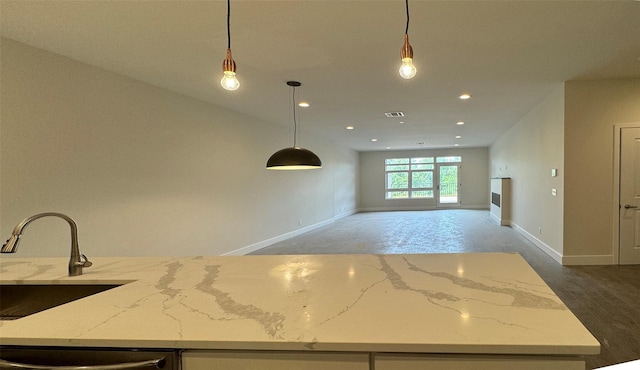 30 Beekman St Unit Ph3, Beacon, NY 12508 - kitchen with light stone countertops, recessed lighting, decorative light fixtures, open floor plan, and dishwasher
