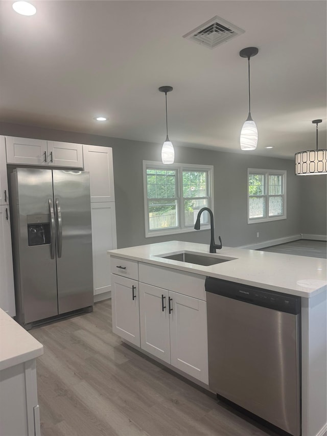 882 Union Blvd, West Islip, NY 11795 - kitchen featuring stainless steel appliances, light countertops, recessed lighting, and white cabinetry