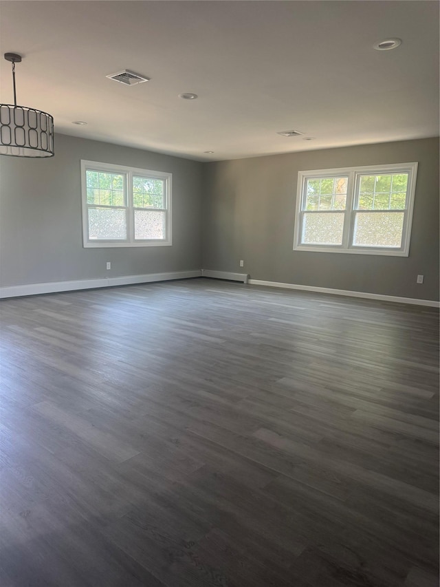 882 Union Blvd, West Islip, NY 11795 - empty room with plenty of natural light, dark wood-style floors, and recessed lighting