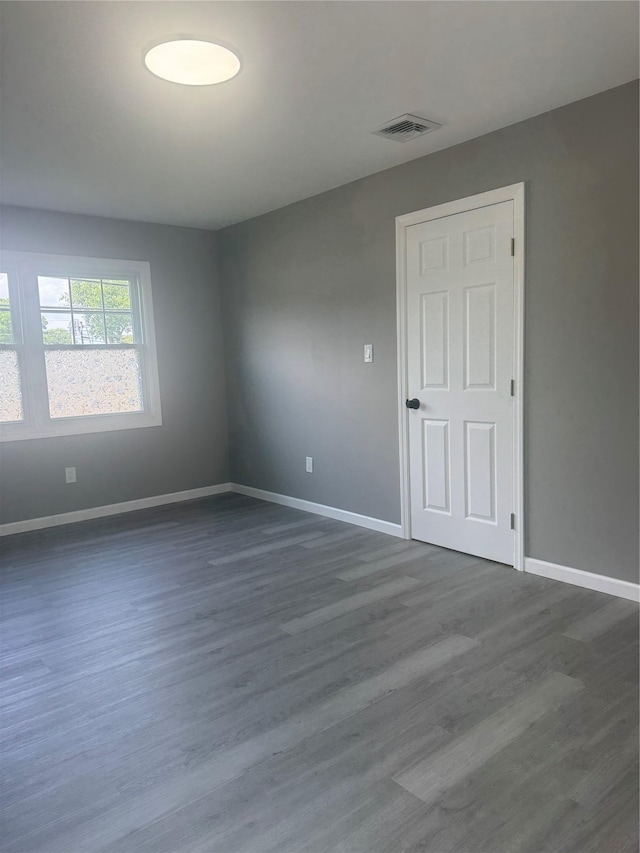 882 Union Blvd, West Islip, NY 11795 - spare room featuring baseboards and dark wood-style floors