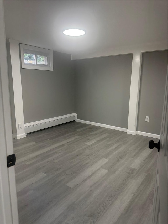 882 Union Blvd, West Islip, NY 11795 - below grade area featuring baseboard heating and wood finished floors