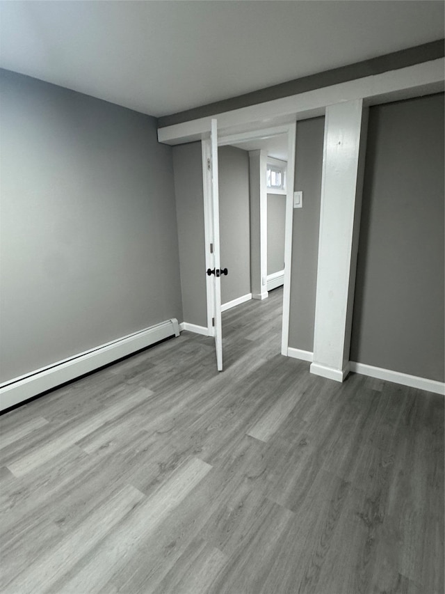 882 Union Blvd, West Islip, NY 11795 - finished below grade area featuring a baseboard radiator and wood finished floors