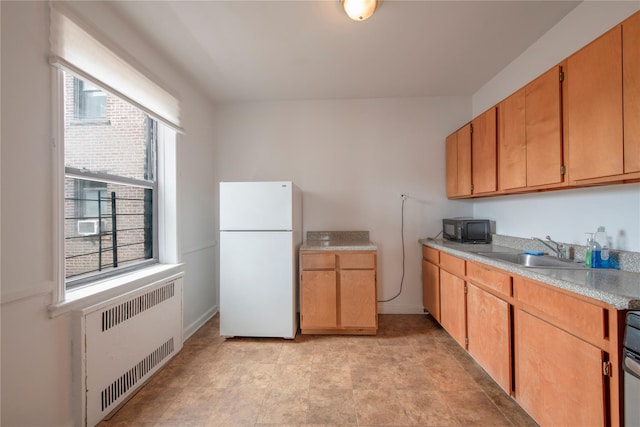 4037 77th St Unit 5B, Elmhurst, NY 11373 - kitchen featuring freestanding refrigerator, radiator, black microwave, light countertops, and range