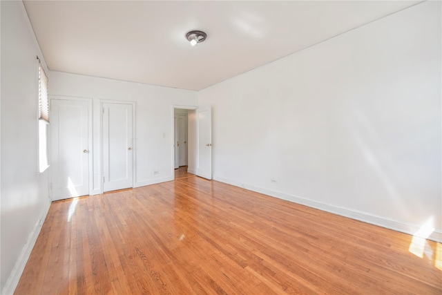 4037 77th St Unit 5B, Elmhurst, NY 11373 - unfurnished bedroom with light wood-style flooring and baseboards