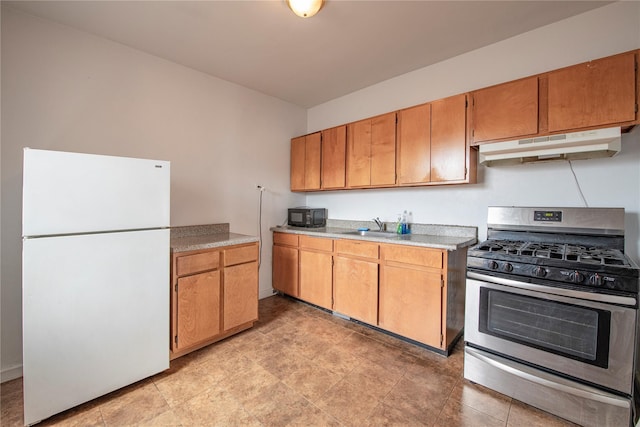 4037 77th St Unit 5B, Elmhurst, NY 11373 - kitchen with freestanding refrigerator, gas stove, under cabinet range hood, black microwave, and light countertops