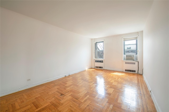 4037 77th St Unit 5B, Elmhurst, NY 11373 - unfurnished room featuring radiator heating unit and cooling unit