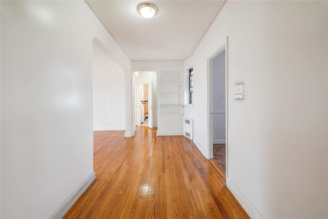 4037 77th St Unit 5B, Elmhurst, NY 11373 - corridor with arched walkways, light wood-style floors, and built in features
