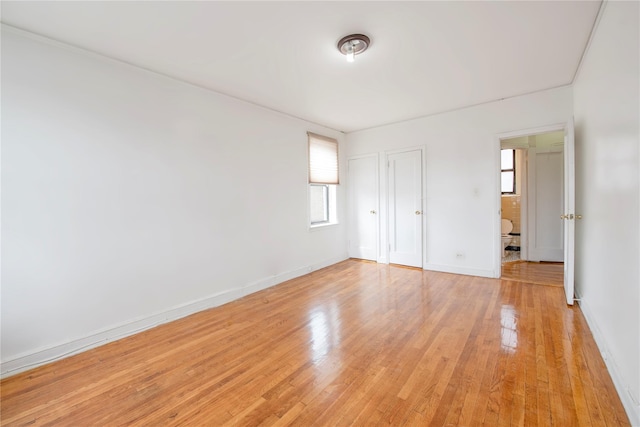4037 77th St Unit 5B, Elmhurst, NY 11373 - unfurnished bedroom with light wood finished floors and a closet
