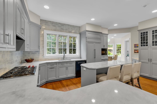 77 Haights Cross Rd, Chappaqua, NY 10514 - kitchen featuring black appliances, gray cabinetry, light wood finished floors, backsplash, and recessed lighting