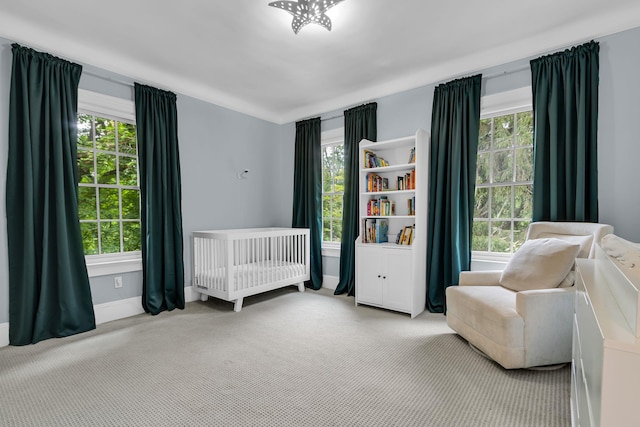 77 Haights Cross Rd, Chappaqua, NY 10514 - carpeted bedroom featuring multiple windows and a nursery area