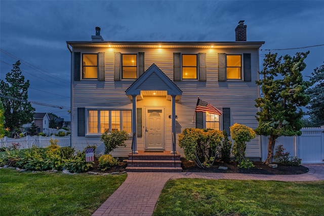 1859 George Ct, Merrick, NY 11566 - view of front of home featuring a chimney