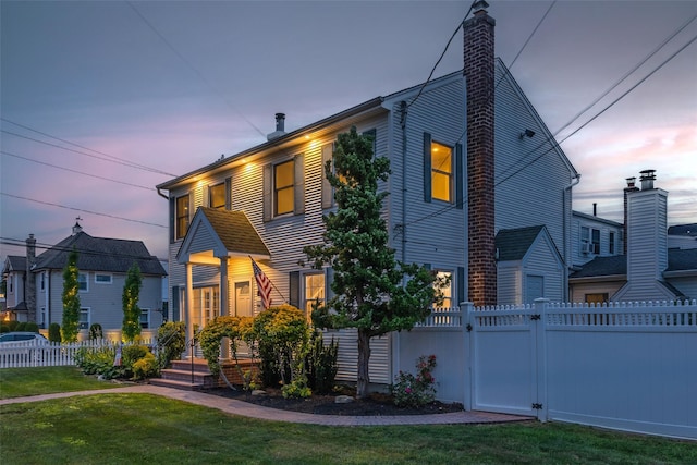 1859 George Ct, Merrick, NY 11566 - view of front facade featuring a chimney and a gate
