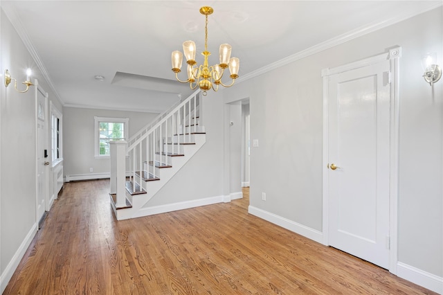 1859 George Ct, Merrick, NY 11566 - foyer featuring stairway, baseboard heating, wood finished floors, a chandelier, and ornamental molding