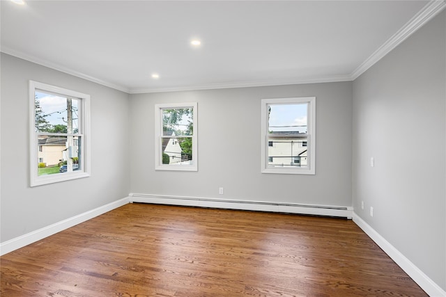 1859 George Ct, Merrick, NY 11566 - empty room with baseboard heating, ornamental molding, wood finished floors, and recessed lighting