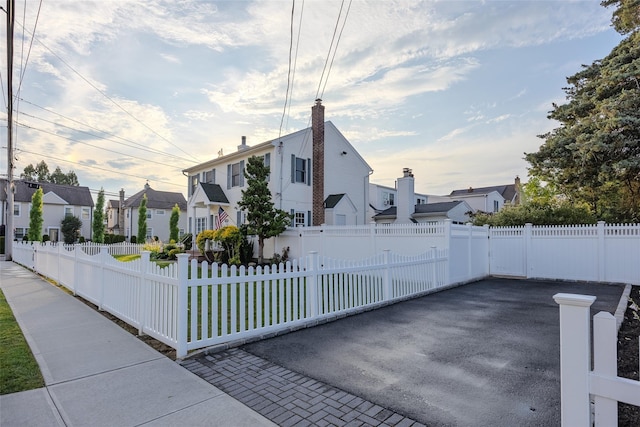 1859 George Ct, Merrick, NY 11566 - view of front of home with a residential view and a fenced front yard