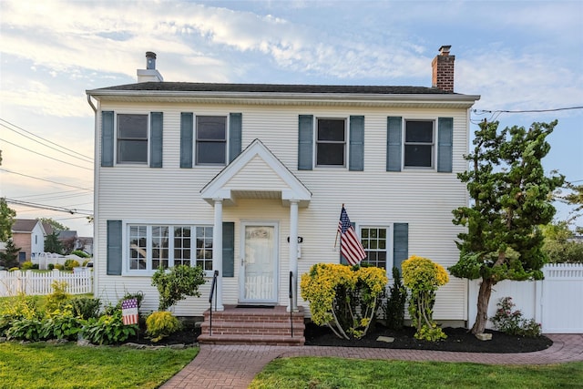 1859 George Ct, Merrick, NY 11566 - view of front of house featuring a chimney
