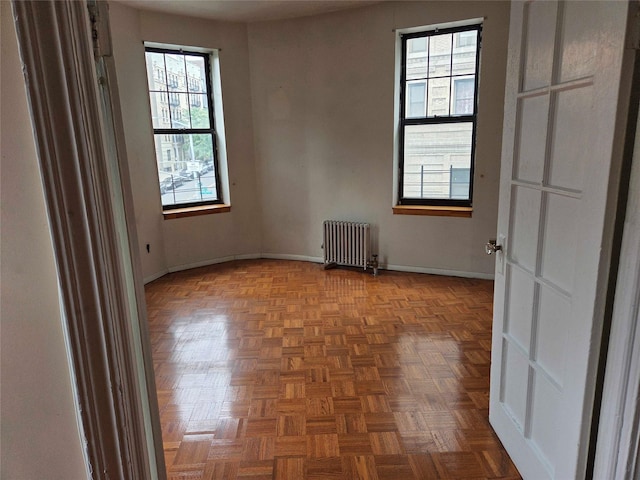 33 Convent Ave Unit 9, New York Manhattan, NY 10027 - spare room featuring radiator heating unit and plenty of natural light