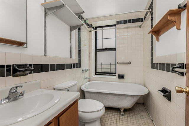 33 Convent Ave Unit 9, New York Manhattan, NY 10027 - bathroom with tile walls, a soaking tub, and vanity