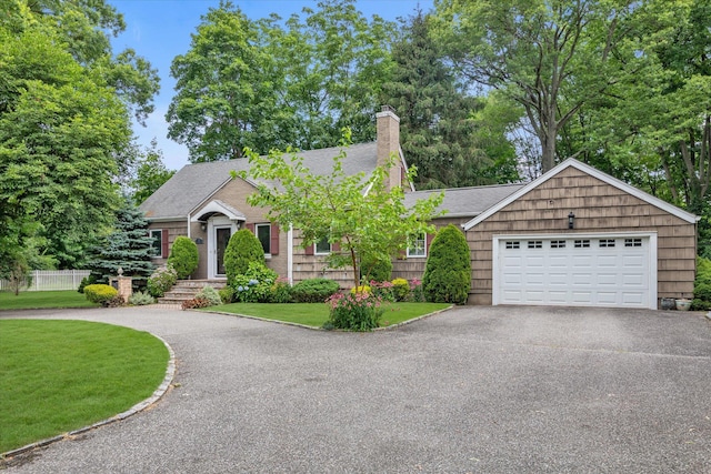 1 Willits Rd, Glen Cove, NY 11542 - ranch-style home featuring driveway, a chimney, roof with shingles, and a garage