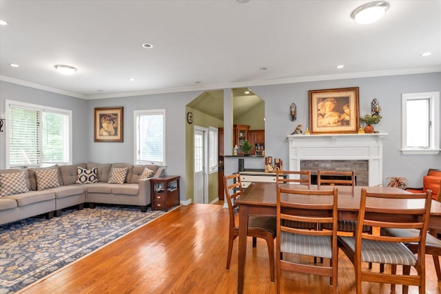 1 Willits Rd, Glen Cove, NY 11542 - dining area with wood finished floors, recessed lighting, a fireplace, and crown molding