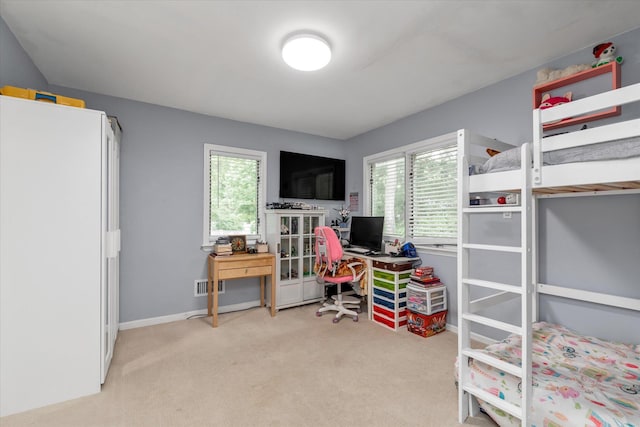 1 Willits Rd, Glen Cove, NY 11542 - carpeted bedroom with multiple windows and a desk