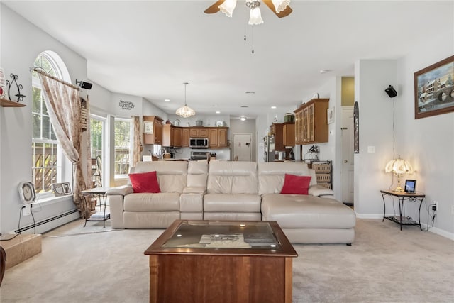 9 Clark Rd, Goshen, NY 10924 - living room with light colored carpet, a ceiling fan, and a baseboard heating unit