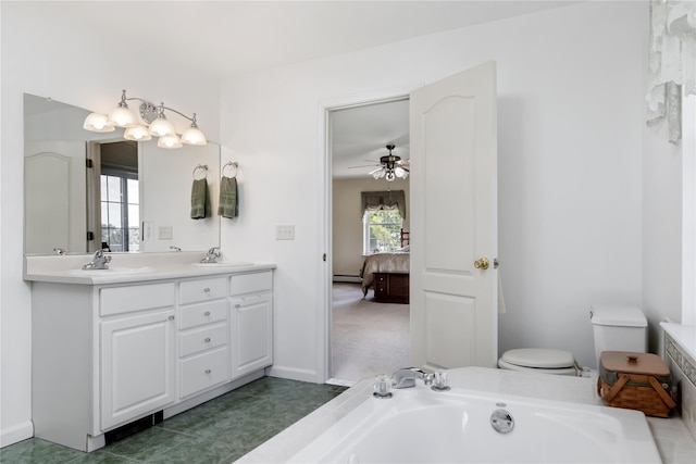9 Clark Rd, Goshen, NY 10924 - bathroom featuring double vanity, a garden tub, ceiling fan, connected bathroom, and a baseboard radiator