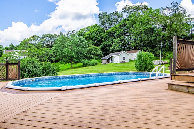 9 Clark Rd, Goshen, NY 10924 - swimming pool featuring a wooden deck, a yard, an outbuilding, and view of wooded area