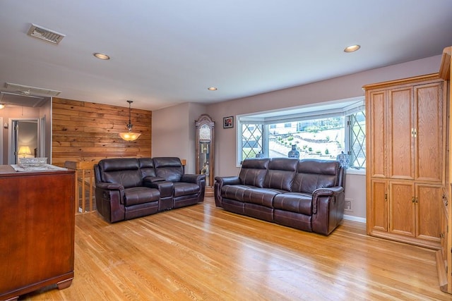 7 Gilmore Dr, Stony Point, NY 10980 - living room with light wood-style flooring, attic access, wooden walls, and recessed lighting
